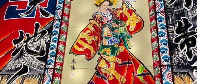 Japanese festival float depicting woman in kimono dancing